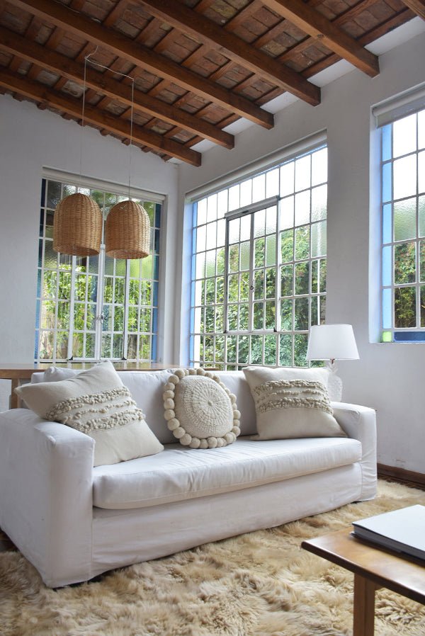 A calm home setting with soft blankets and cushions