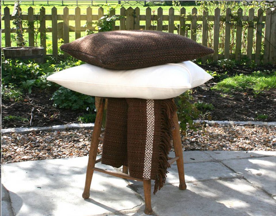 Cozy throws and cushions arranged for everyday comfort